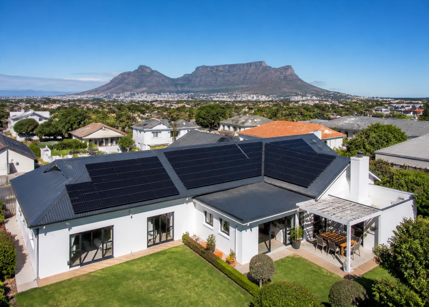 Completed residential solar installation in Cape Town with Table Mountain behind
